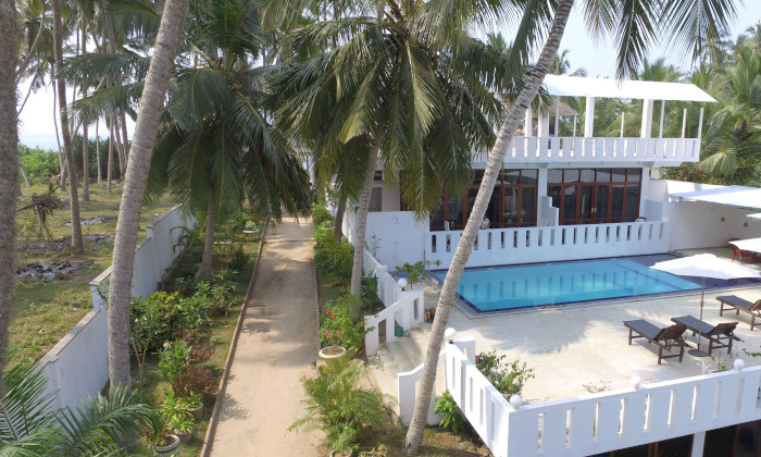 aerial drone image of hotel garden and swimming pool